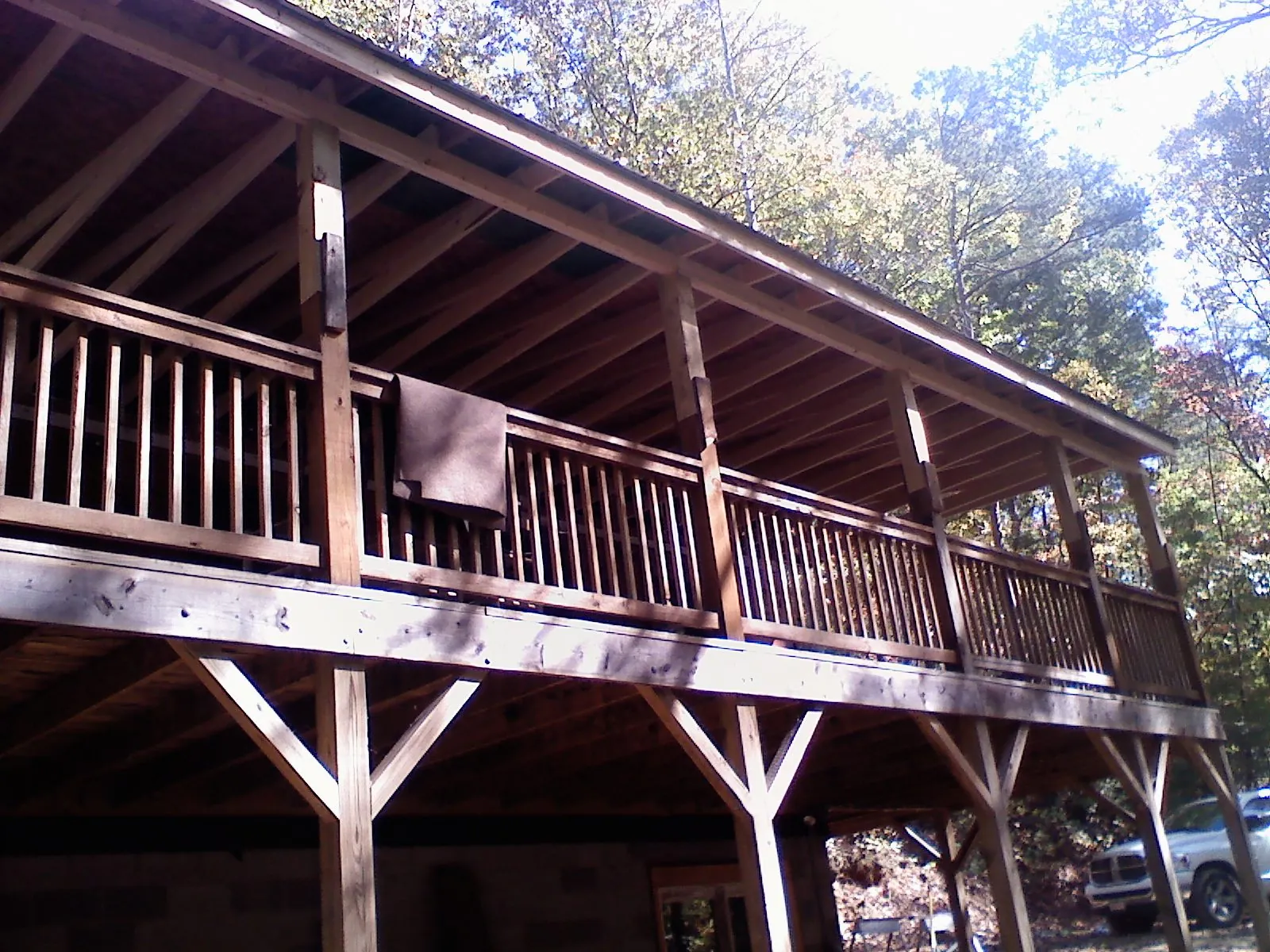 Timber framing under a new elevated porch and deck — Roof Leak Repair in Kindred by Roofing Brothers